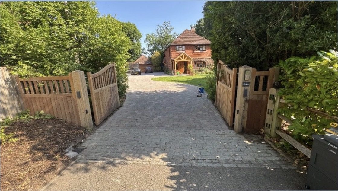 The gates after sanding back to bare timber, set in their natural setting before re-oiling